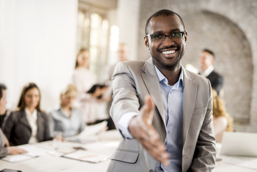 Business person offering handshake